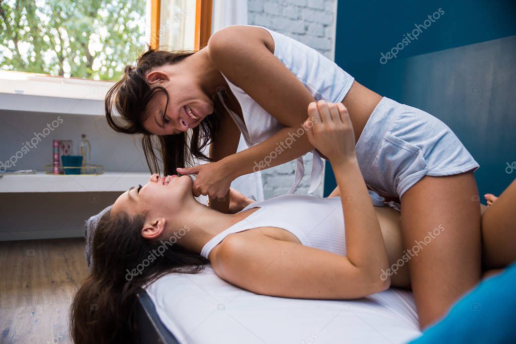 Lesbian couple scissoring