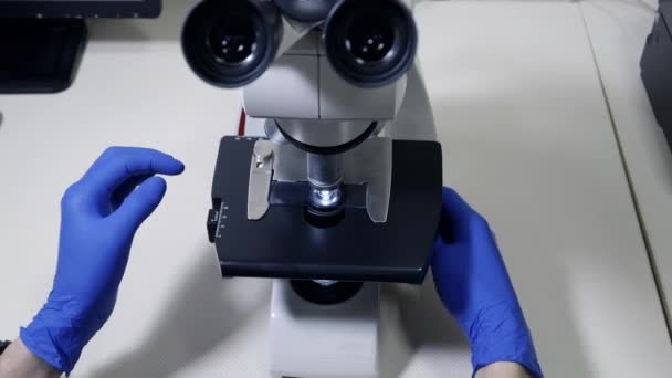 Student Physician Analyzes Blood Microscope Top View Scientist Sets Glass — Stock Video