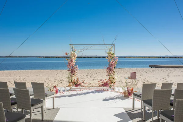 Event decoration. Wedding chuppa at riverside decorated with fresh flowers. Florist workflow — Stock Photo, Image
