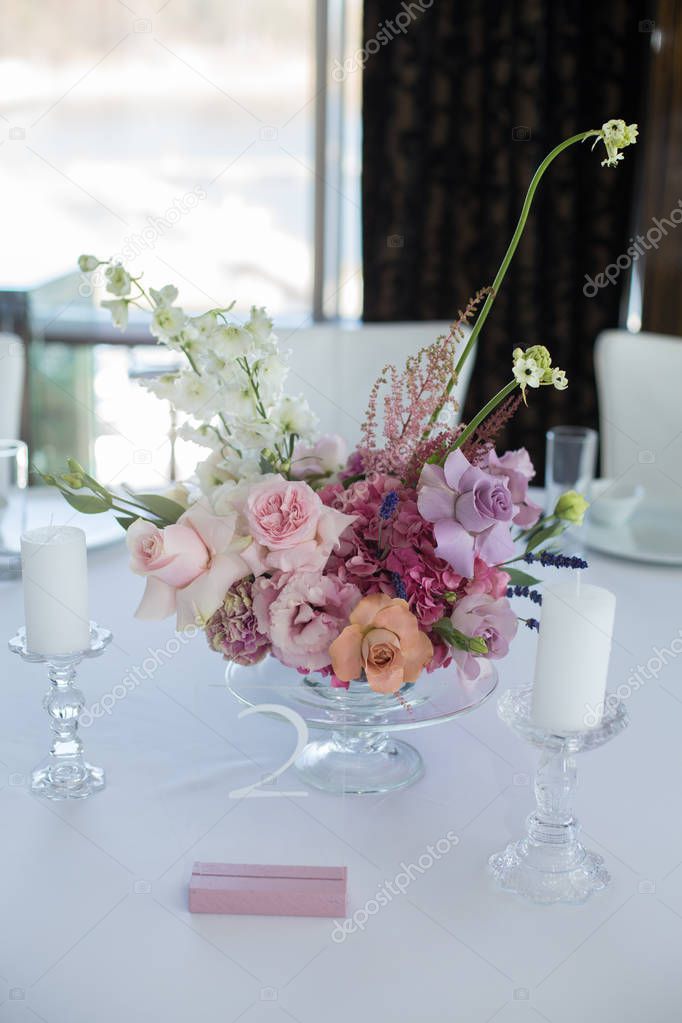 Event white restaurant table served and decorated with delicate 