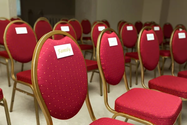 Seating chairs for guests at a wedding ceremony in the festive h