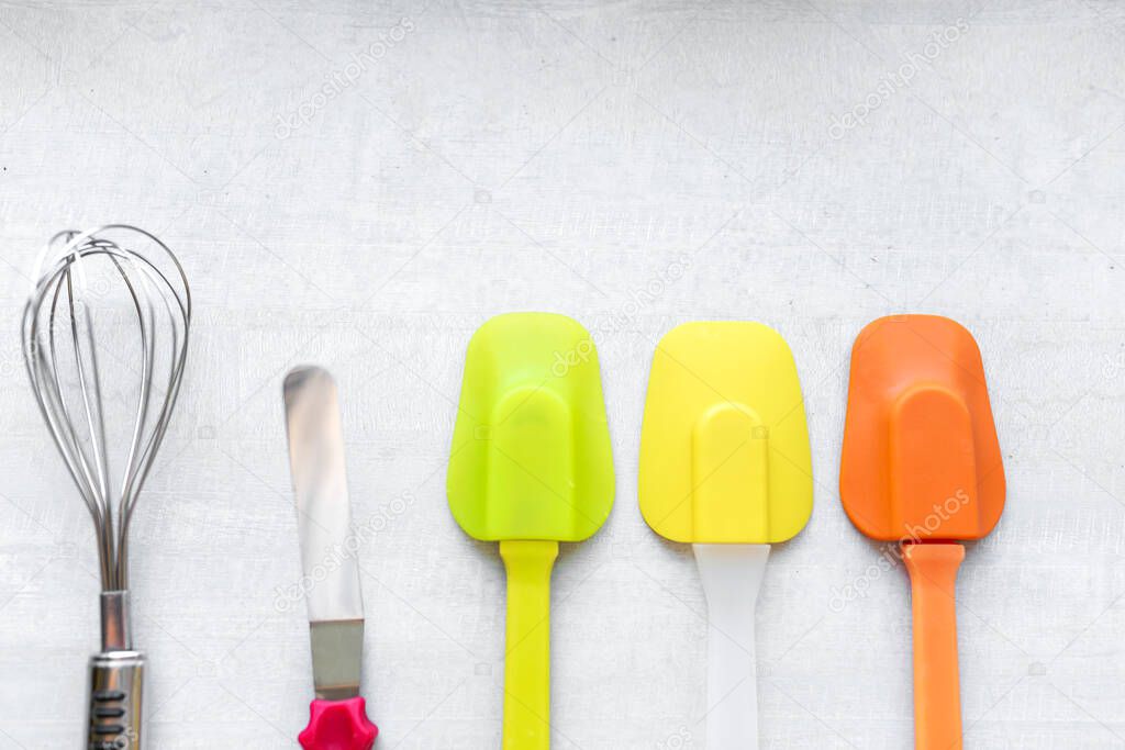 Set of multi-colored silicone spatulas, kitchen tools. Sweet pastries, recipes, cooking.