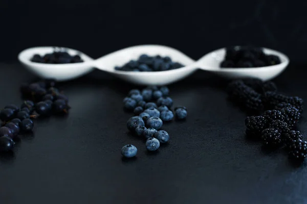 Set Different Types Black Berries White Plate Black Table Stylish — Stock Photo, Image