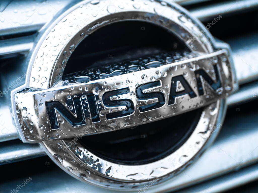 Nissan car nameplate emblem in water drops. Dnipro / Ukraine - 04.27.2019