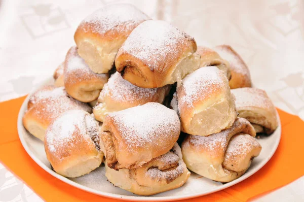 A stack of buns on a white plate — Stock Photo, Image