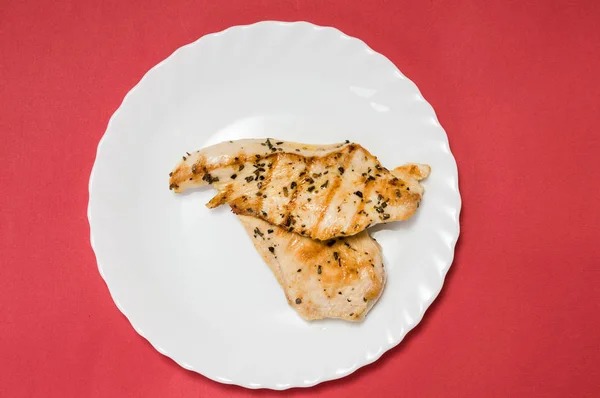 Grilled chicken fillet on white plate — Stock Photo, Image
