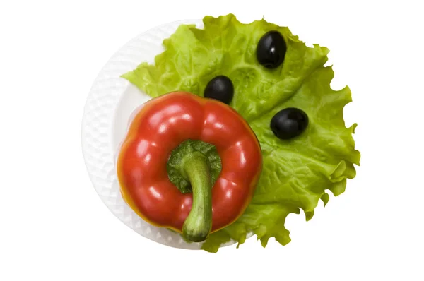 Bell pepper, olives, salad lettuce on white plate isolated on white background — Stockfoto