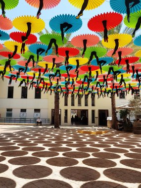 TEL AVIV,ISRAEL- June 01,2018: Tel-Aviv Suzanne Dellal Center for Dance and Theater with Colorful Decorations .This Original Decoration make  Shadow in Hot Summer Day . The Centre is located in the center of historic Neve Tzedek, Tel Aviv,Israel clipart