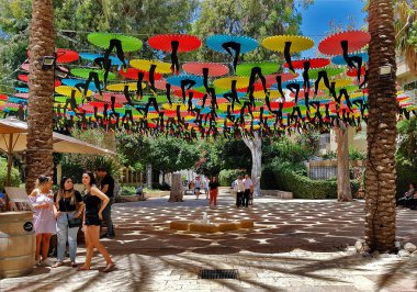 TEL AVIV,ISRAEL- June 01,2018: Tel-Aviv Suzanne Dellal Center for Dance and Theater with Colorful Decorations .This Original Decoration make  Shadow in Hot Summer Day . The Centre is located in the center of historic Neve Tzedek, the first neighborho clipart