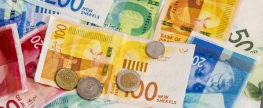 İsrail Yeni Şekeli banknot ve madeni paraların arka plan. Kavramsal görüntü için Finans ve bankacılık