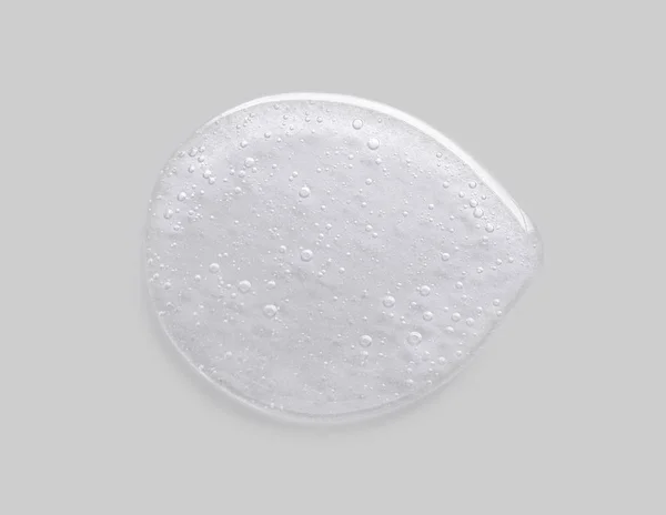 Kozmetik sıvı kollajen serum gri arka plan üzerinde jel.