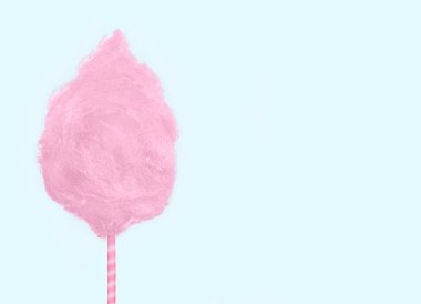 Yumuşak nane yeşil arka plan üzerinde izole tatlı pembe pamuk şeker.