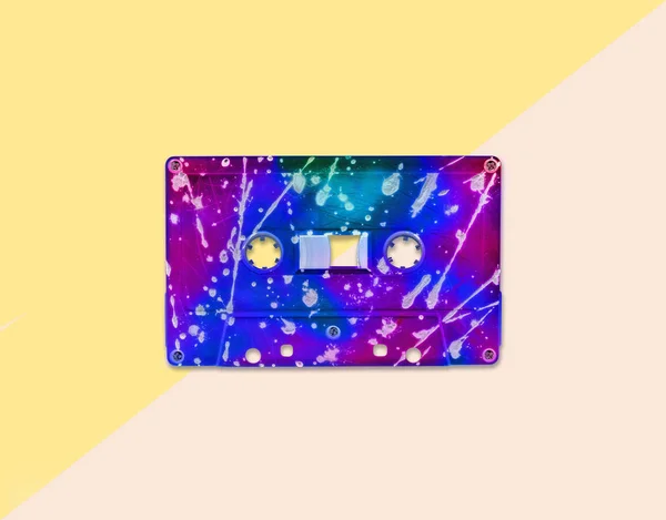 Vintage neon audio cassette tape on pastel background. Trendy pop art style. — Stock Photo, Image
