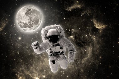 Astronot uzayda dünyanın üzerinde uçar. Bu görüntünün elementleri NASA tarafından desteklenmektedir