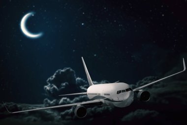 gece gökyüzü ve güneş arka planlar üzerinde uçak uçar