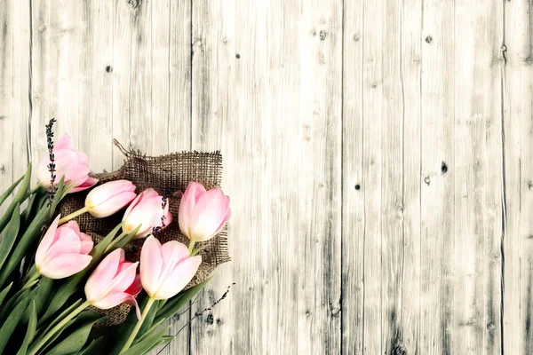 A spring tulips on wood background — Stock Photo, Image