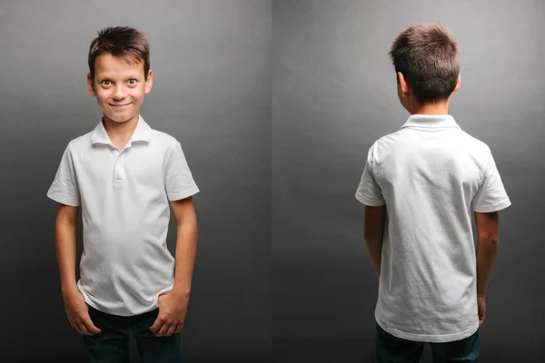 Modelu dítě pózuje na šedém pozadí — Stock fotografie