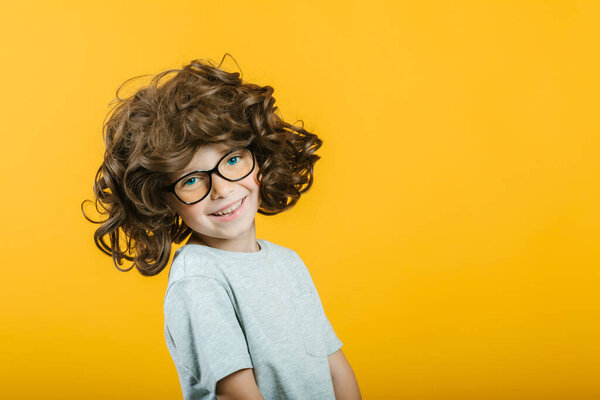 model child posing on yellow background