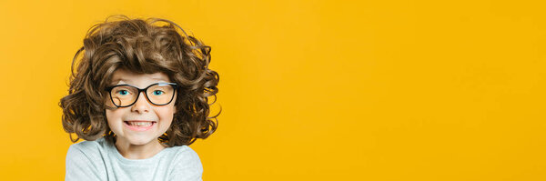 model child posing on yellow background