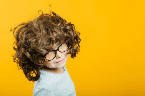 model child posing on yellow background