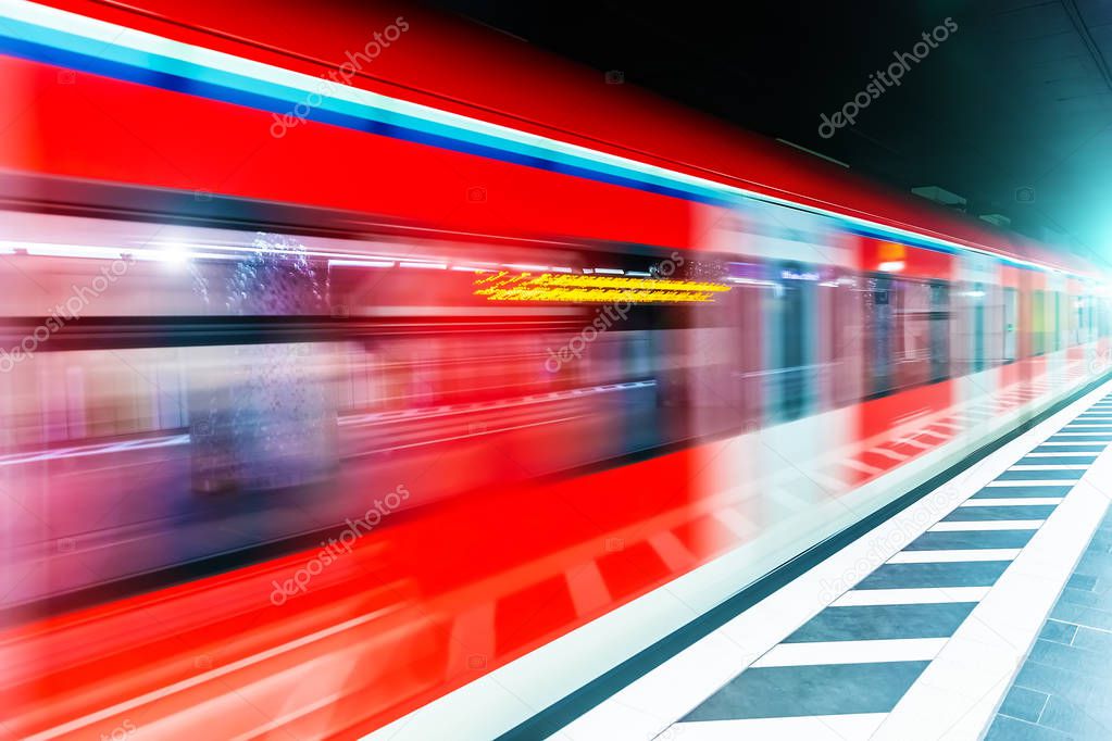 Creative abstract commuter city business travel transportation concept: subway underground metro train at railway station platform with high speed motion blur effect