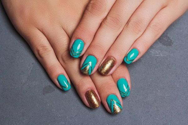 Summer nail art in turquoise and gold colors