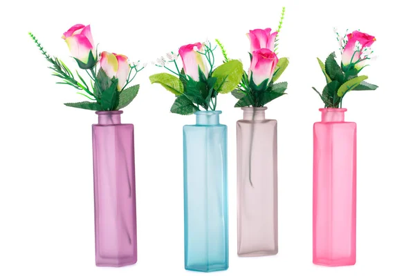 白色背景的玻璃花瓶中的彩色布料玫瑰 — 图库照片