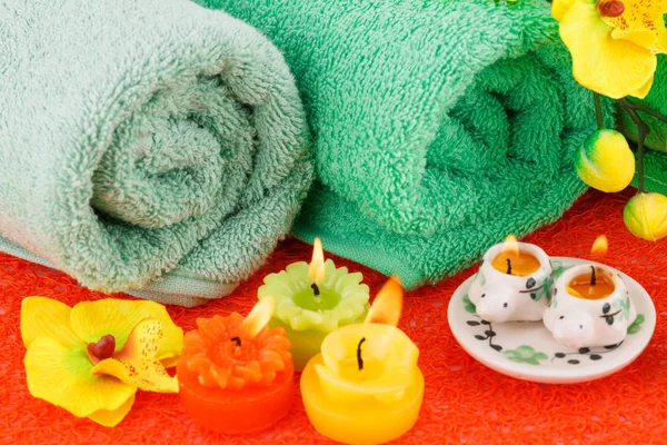 Spa Set Towels Candles Flowers Red Plastic Background — Stock Photo, Image