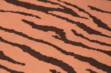 Arkaplan olarak desenli kahverengi kumaş dokusu.