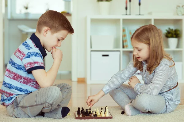 Portrait Two Little Children Concentrated Playing Chess Home — Stock Photo, Image