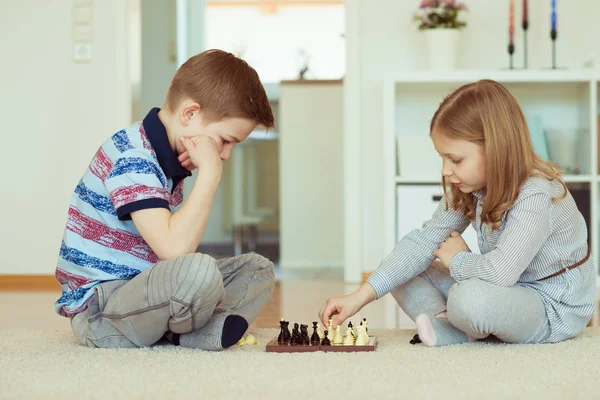 Portrait Two Little Children Concentrated Playing Chess Home — Stock Photo, Image