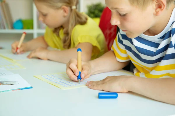 Cute schoolchildren are came back to school and learning at the — Stock Photo, Image