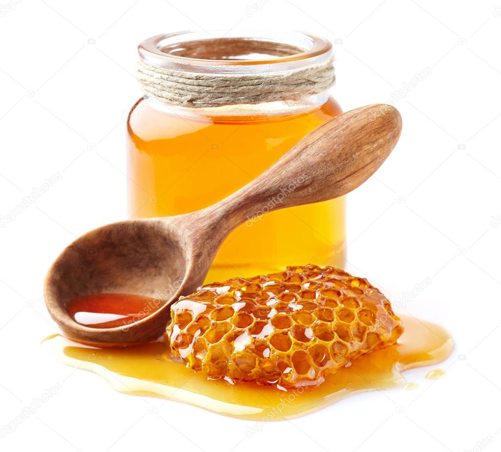 Honey with honeycomb on white background