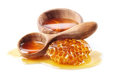 Honey with honeycomb and wooden spoon clipart
