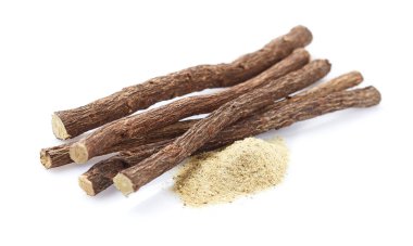 Licorice powder with licorice roots on white background clipart