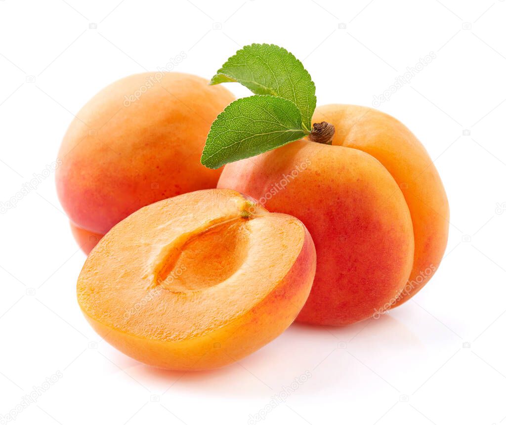 Ripe apricot with leaves in closeup