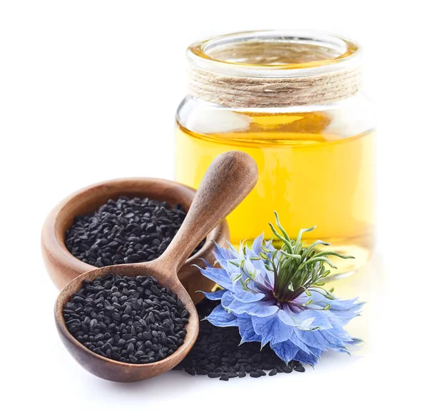 Aceite Comino Negro Con Flor Sobre Fondo Blanco — Foto de Stock