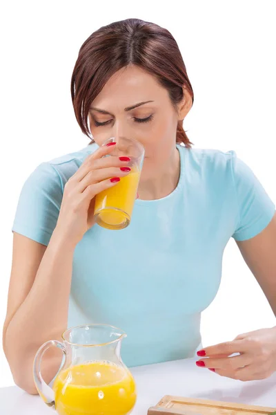 Female drinking juice from glass isolated close up — Stock Photo, Image