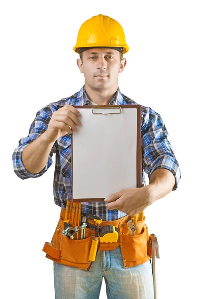 Joven trabajador de la construcción con muchas herramientas sujetando el portapapeles con — Foto de Stock