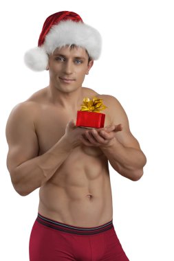 bir kaslı çıplak yakışıklı gülümseyen adam santa kap GIF holding ile