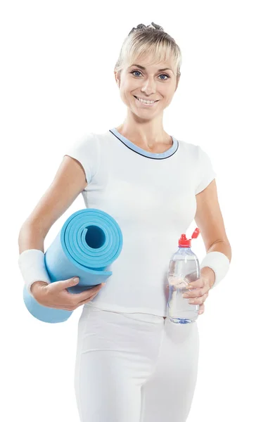 Beautiful smiling  sports woman holding bottle of water and yoga — Stock Photo, Image