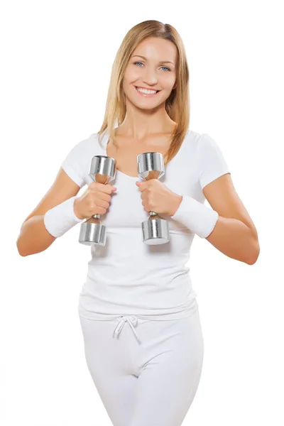 Beautiful smiling sporty female wearing white sports clothes hol — Stock Photo, Image