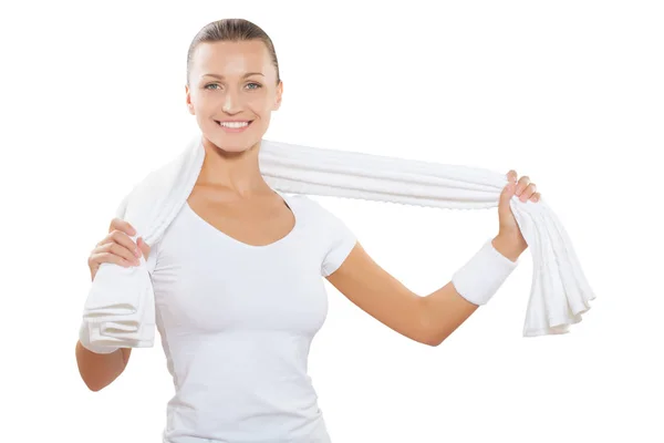Beautiful sporty female wearing white sports clothes holding cot — Stock Photo, Image