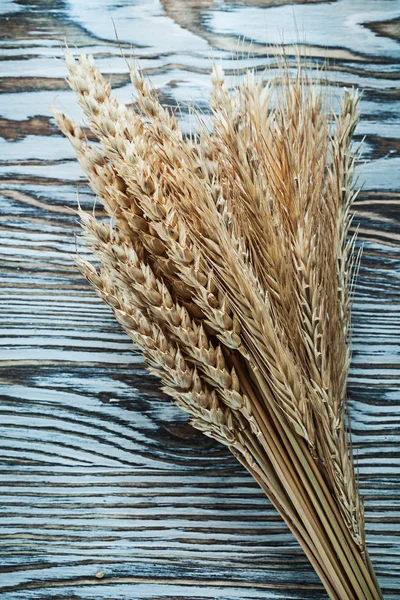 Wheat ears on vintage wooden board — Stock Photo, Image