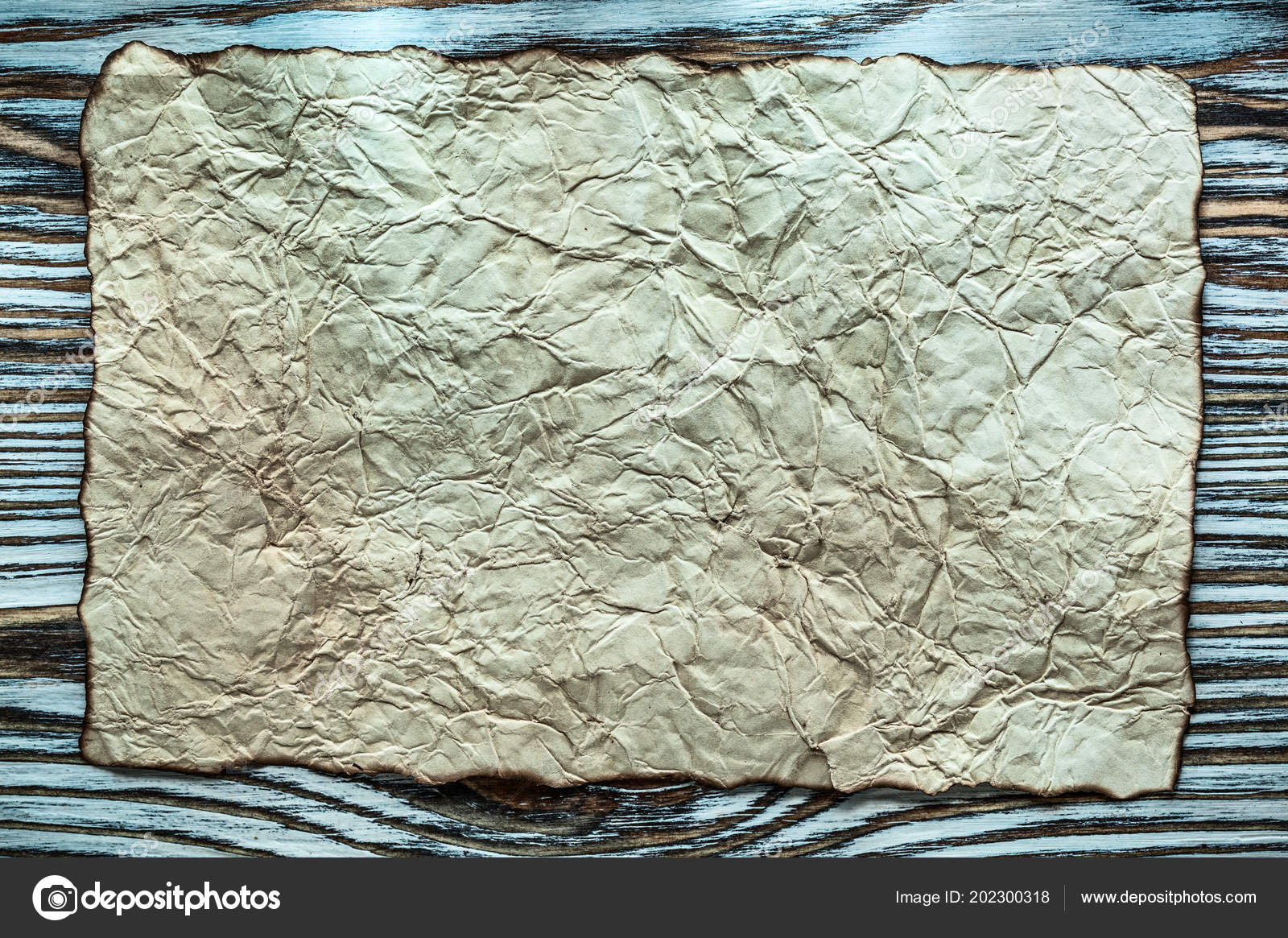 Vintage parchment on wooden board Stock Photo by ©mihalec 202300318