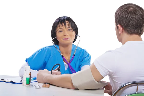 Asian female doctor with patient near the table isolated — Stock Photo, Image