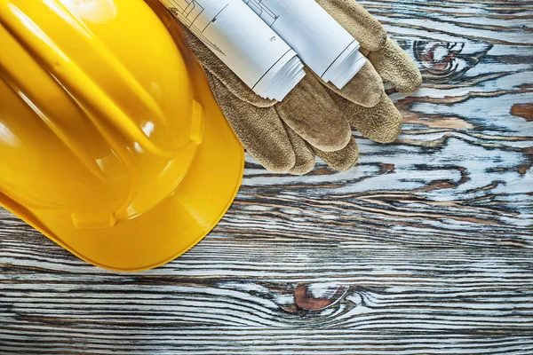 Leather safety gloves construction drawings hard hat on vintage — Stock Photo, Image