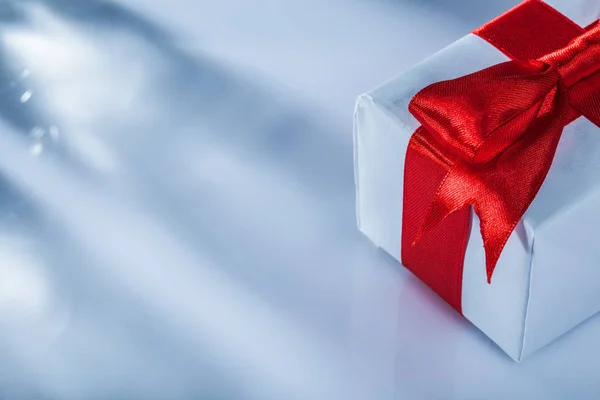 Red present box on white background horizontal image