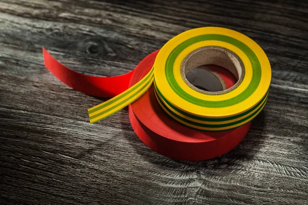 Pair Insulation Tapes Wooden Board — Stock Photo, Image