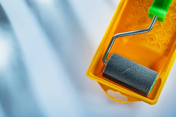 Paint tray roller on white background.